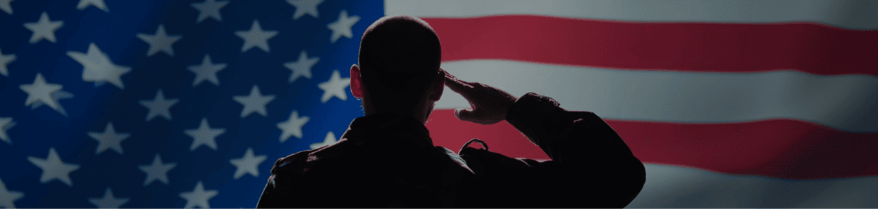 Contact Us Hero: Veteran Saluting the American Flag